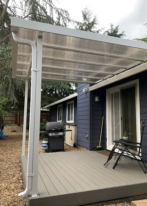 Residential deck with white aluminum patio cover installed at a Portland Oregon home