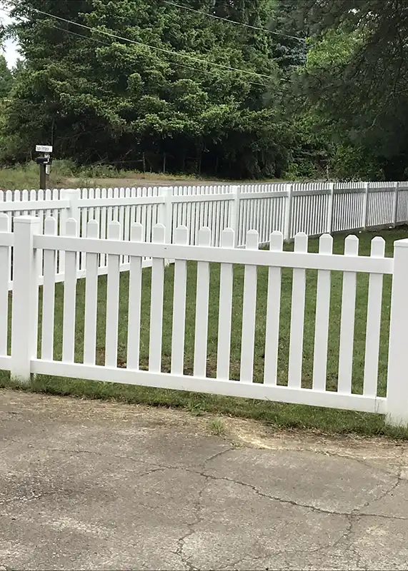 Three foot tall white picket fence bordering a residential yard in Beaverton, Oregon